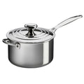 Le Creuset 4 Qt. Stainless Steel Saucepan with Lid and Helper Handle from a side view displayed on a white background