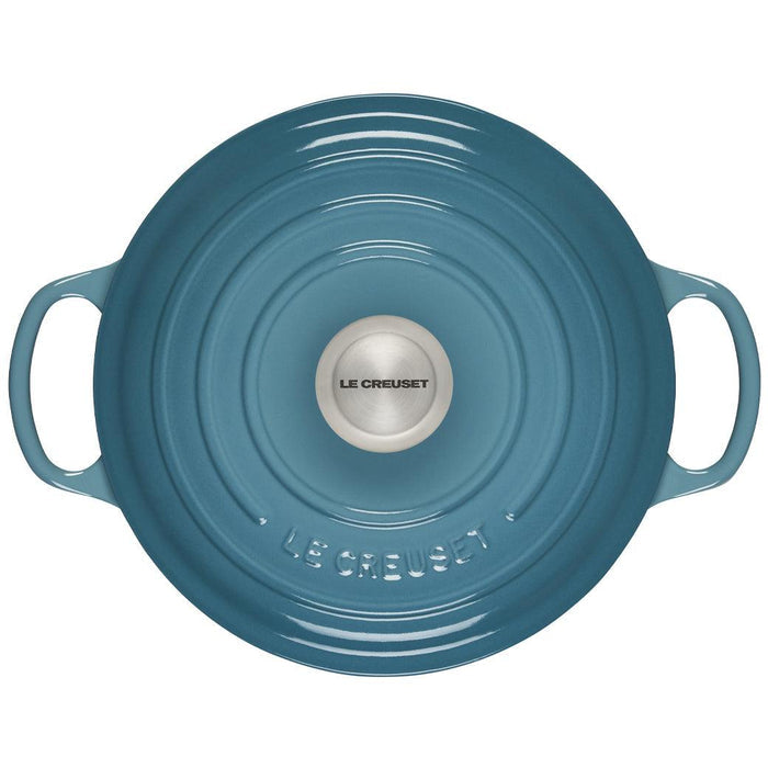 Caribbean 5.25 Qt Deep Le Creuset enameled cast iron Dutch oven with the lid on from the top view on a white background