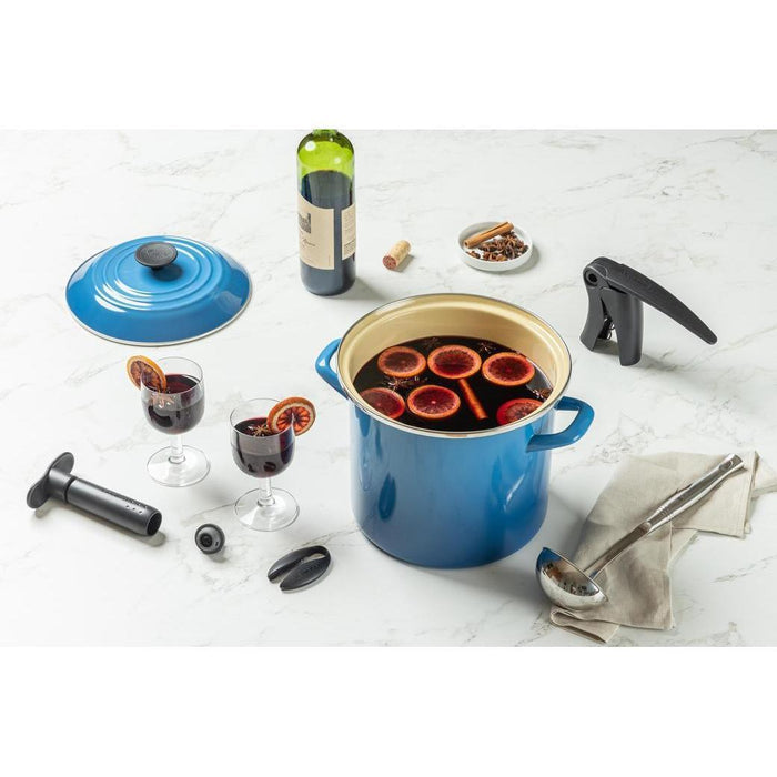 Marseille Black knob Stockpot displayed with the Le Creuset wine opener and wine glasses on a marble background