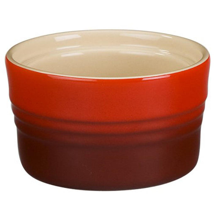 Side view of Cerise Le Creuset 7 oz Stoneware Stackable Ramekin displayed on a white background