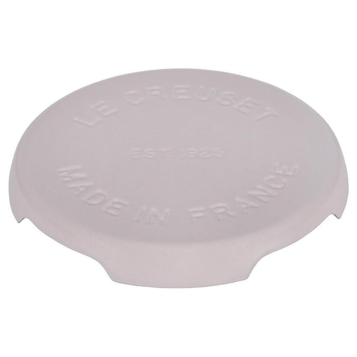 8.8 inch shallot Le Creuset enameled cast iron signature trivet displayed on a white background