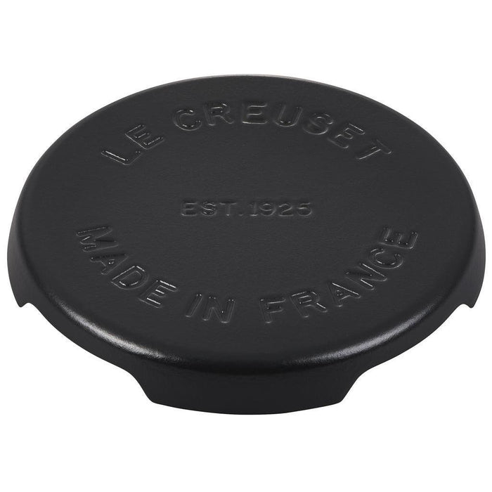 8.8 inch licorice Le Creuset enameled cast iron signature trivet displayed on a white background