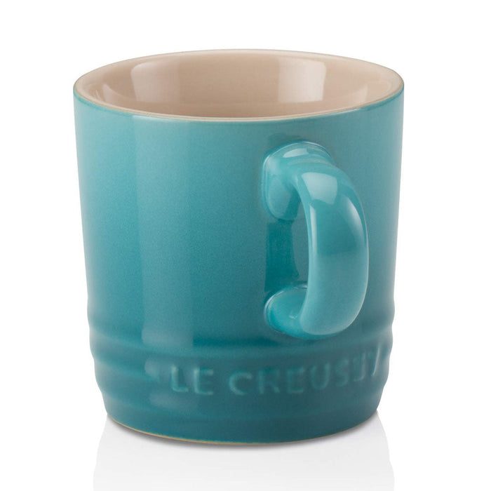 Side view of 3 oz. Caribbean Le Creuset Stoneware Espresso Mug displayed on a white background