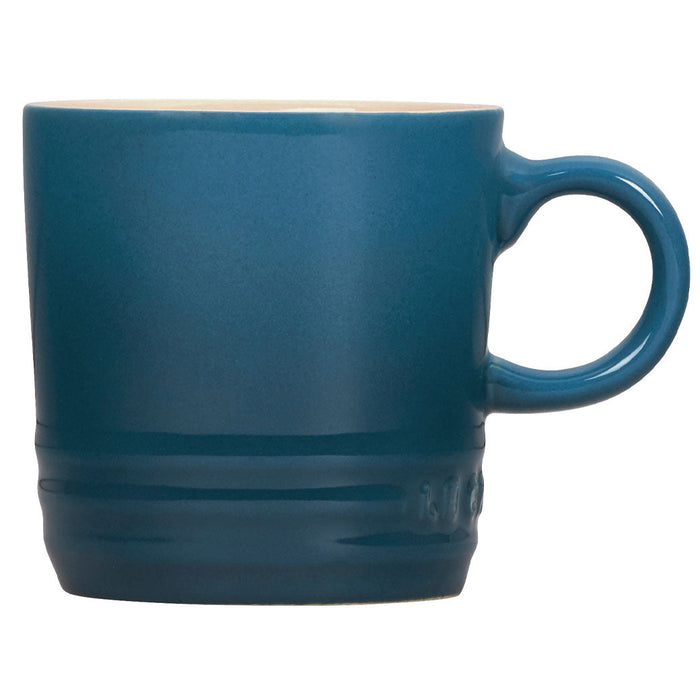 Front view of 3 oz. Deep Teal Le Creuset Stoneware Espresso Mug displayed on a white background