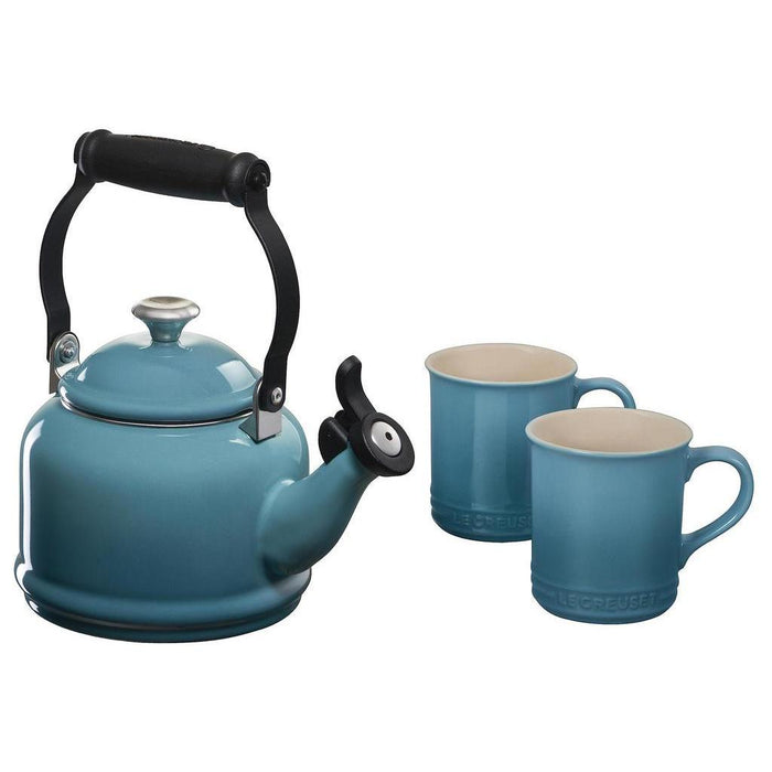 Caribbean tea kettle with two Caribbean colored mugs displayed on a white background