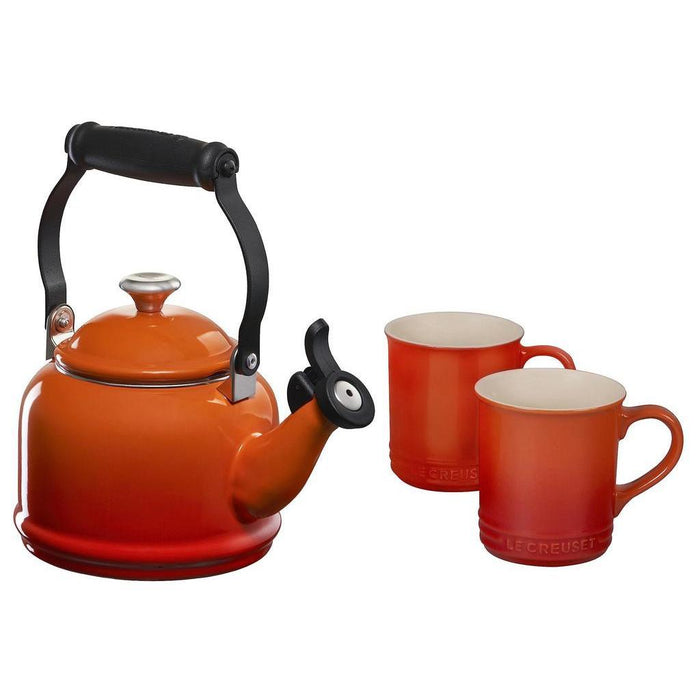 Flame tea kettle with two flame colored mugs displayed on a white background