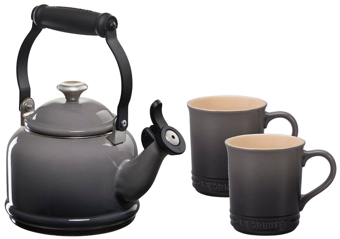 Oyster stovetop kettle with two oyster colored mugs displayed on a white background