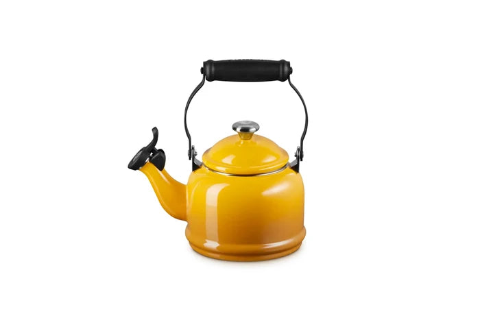 A bright yellow enamel kettle with a black handle and spout lid, shown on a solid white background.