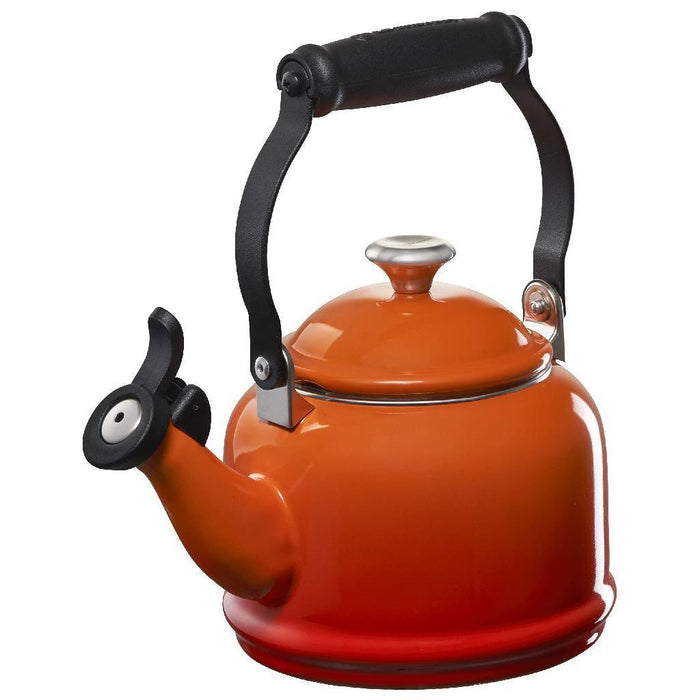 1.25 qt flame Le Creuset enamel on steel demi tea kettle with metal finishes displayed on a white background