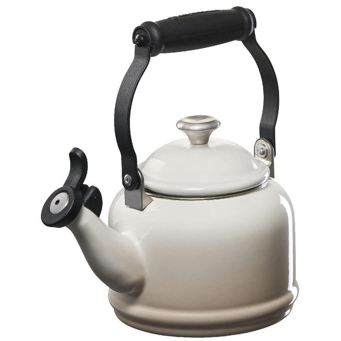 1.25 qt meringue Le Creuset enamel on steel demi tea kettle with metal finishes displayed on a white background