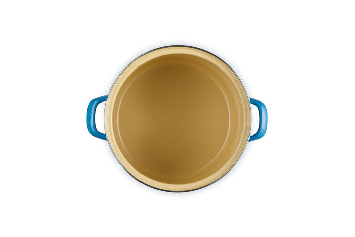 Beige inside stockpot with Marseille handles on a white background