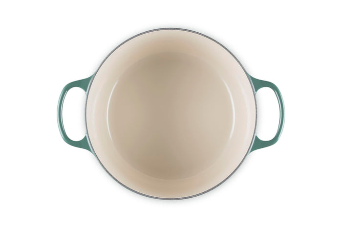 Artichaut enameled cast iron skillet on a white background