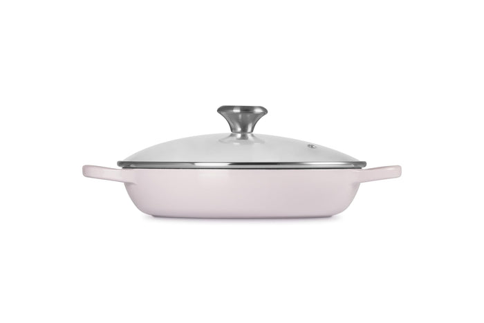 A shallot Le Creuset Enameled Cast Iron Signature Round Braiser with a glass lid on a white background