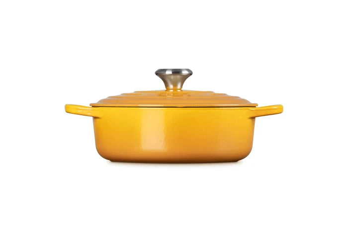 Side view of 3.5 qt Nectar Le Creuset Signature Round Wide Dutch Oven with a lid displayed on a white background