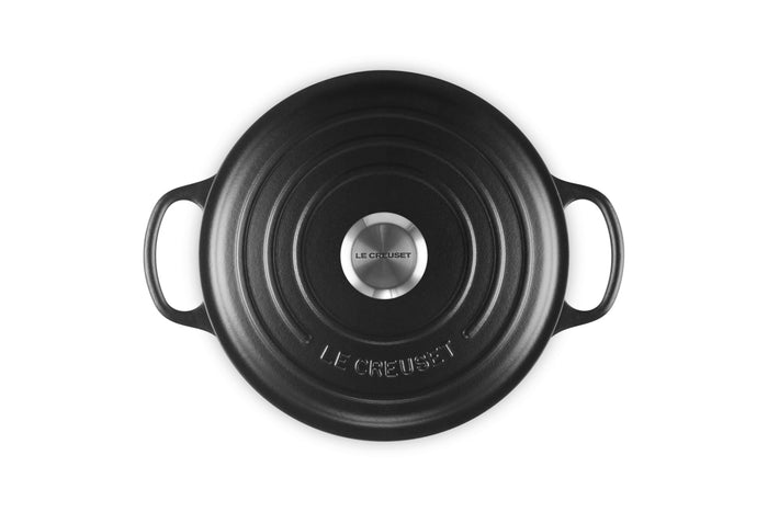 Top view of 3.5 qt Licorice Le Creuset Signature Round Wide Dutch Oven with a lid displayed on a white background