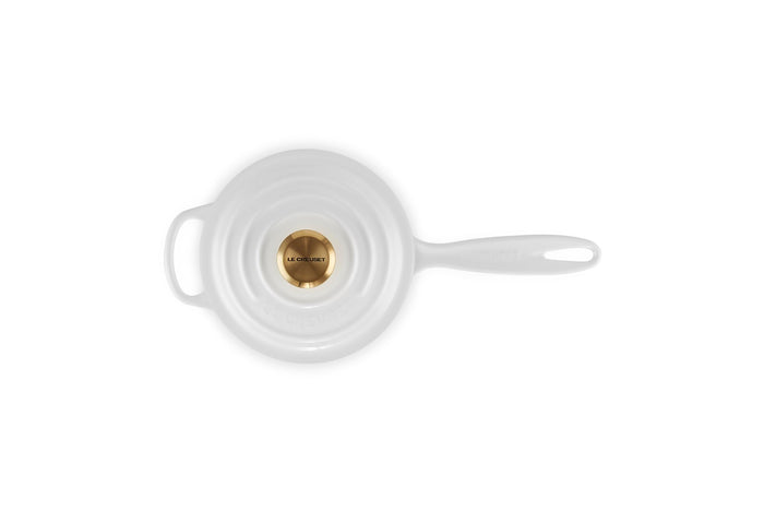 White cast iron skillet on a white background