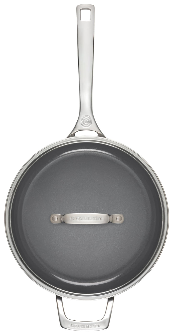 Stainless steel frying pan with a gray non-stick surface on a white background