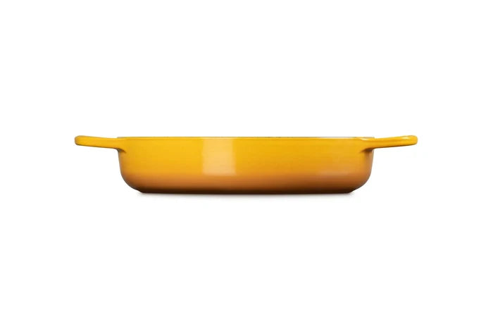 A bright yellow rectangular baking dish with two small side handles, shown from a front-facing perspective on a solid white background.