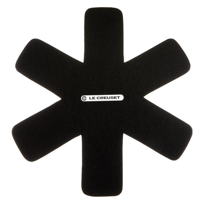 Top view of black Le Creuset Felt Pan Protector displayed on a white background