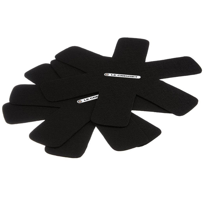 Black Le Creuset Felt Pan Protectors Set of 3 displayed stacked on each other on a white background