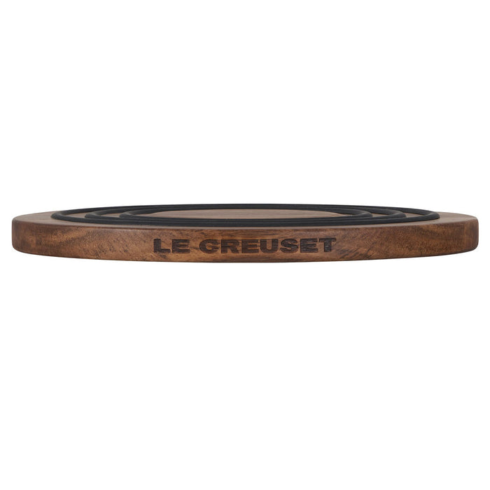 Side view of Le Creuset magnetic wooden trivet displayed on a white background
