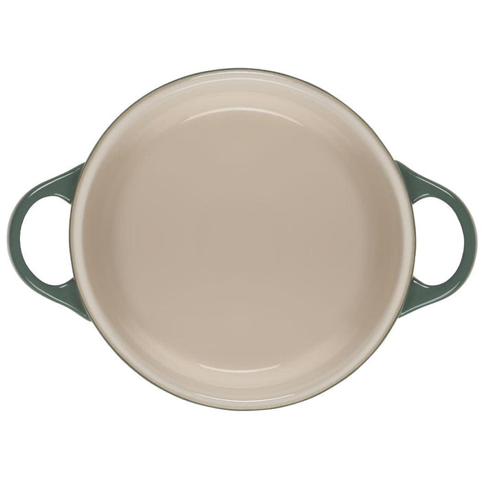 Top view of the inside of Le Creuset Mini Round Cocotte 14 oz displayed on a white background