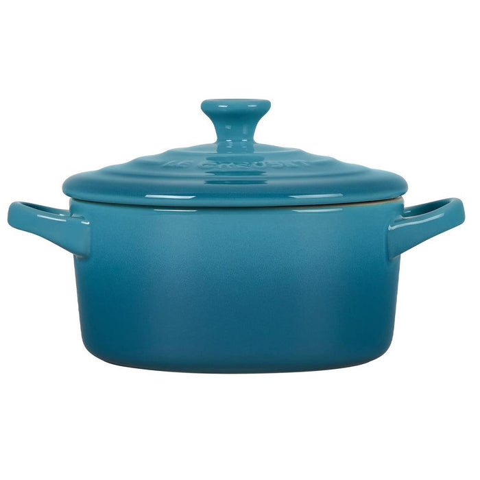 Side view of sea salt Le Creuset Mini Round Cocotte 14 oz with lid displayed on a white background