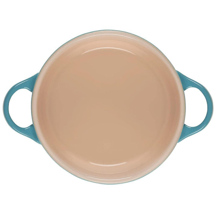 Top view of the inside of Le Creuset Mini Round Cocotte 14 oz displayed on a white background
