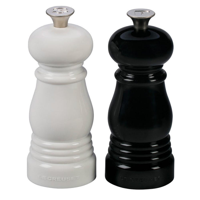 Front view of black and white Le Creuset Petite Salt and Pepper Mill Set displayed on a white background