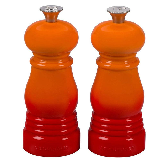 Front view of flame Le Creuset Petite Salt and Pepper Mill Set displayed on a white background