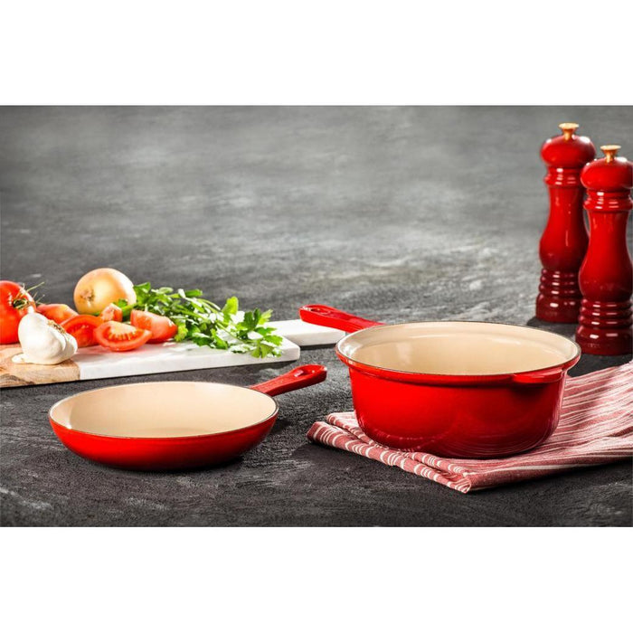 Le Creuset Salt Mill next to cooking food materials and other Le Creuset cookware