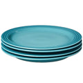 Caribbean Le Creuset Set of (4) 10.5″ Dinner Plates displayed stacked on a white background