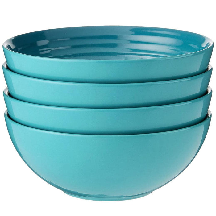 Caribbean Le Creuset Set of (4) 22 oz. Soup Bowls displayed stacked on a white background