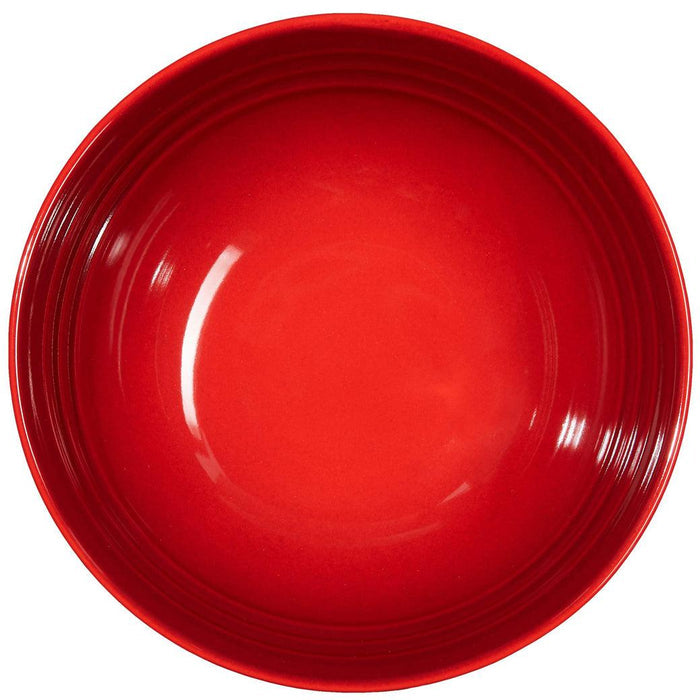 Top view of cerise Le Creuset 22 oz. Soup Bowl displayed on a white background