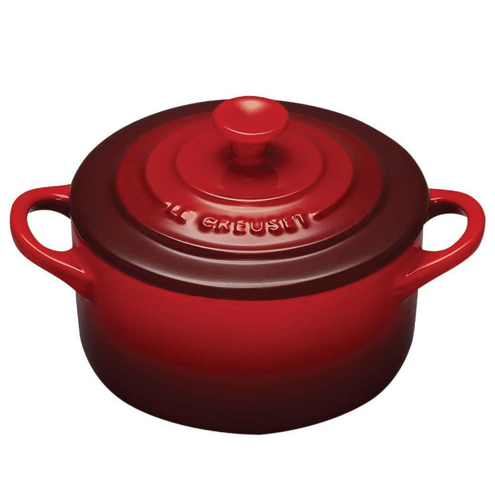 Cerise Le Creuset Cocottes with lid displayed on a white background
