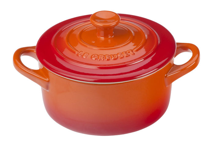 Flame Le Creuset Cocottes with lid displayed on a white background
