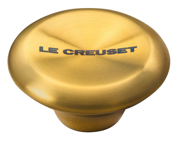 Small Le Creuset Signature Gold Knob displayed on a white background