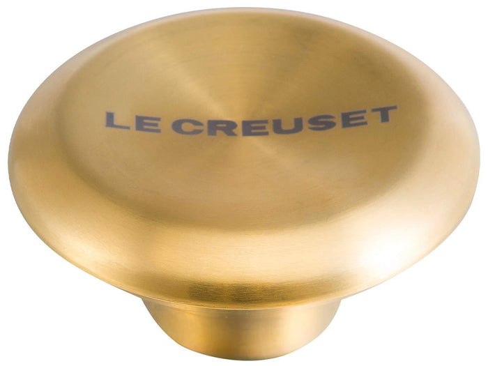 Large Le Creuset Signature Gold Knob displayed on a white background