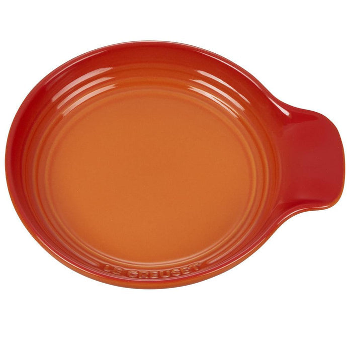 Top view of Flame Le Creuset Signature Stoneware Spoon Rest, 6″ displayed on a white background