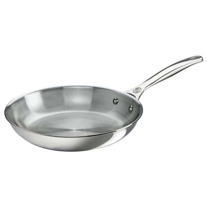Stainless steel frying pan on a white background