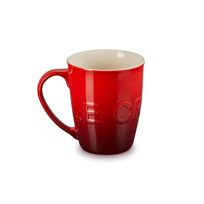 20 oz cerise Le Creuset stoneware coffee mug displayed on a white background