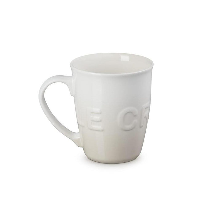 20 oz meringue Le Creuset stoneware coffee mug displayed on a white background