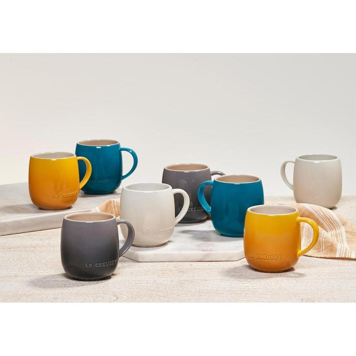 A colorful assortment of 13 oz Le Creuset stoneware heritage mugs