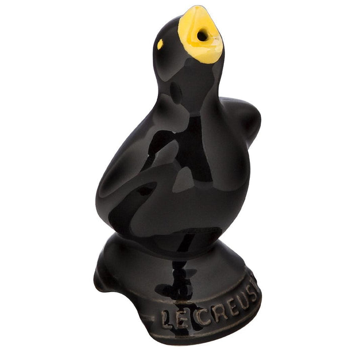 Black with yellow beak Le Creuset Stoneware Pie Bird displayed on a white background