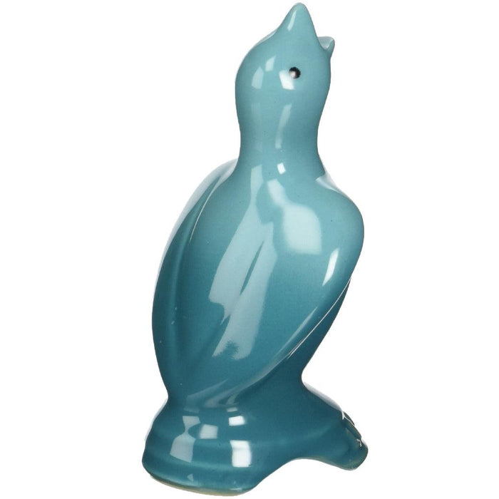 Back view of Caribbean Le Creuset Stoneware Pie Bird displayed on a white background