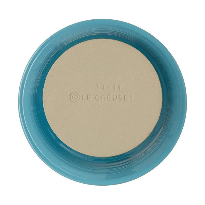 Bottom view of Caribbean Le Creuset Stoneware Pie Dish displayed on a white background