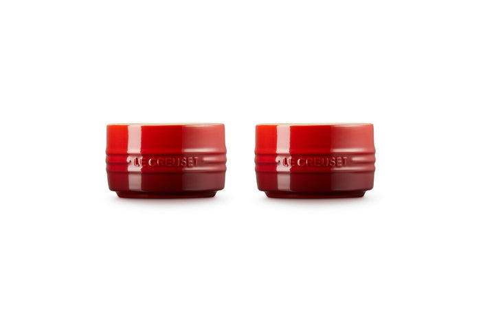 Front view of set of two cerise Le Creuset stoneware round ramekin straight wall on a white background