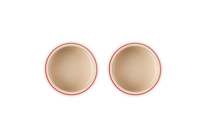 Top view of set of Cerise two Le Creuset stoneware round ramekin straight wall on a white background