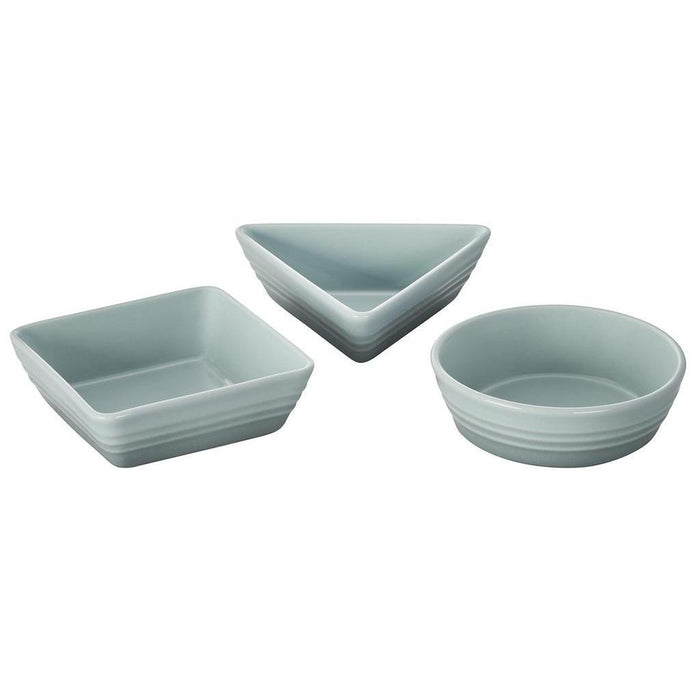 Set of 3 sea salt Le Creuset stoneware tapas dishes of different shapes displayed on a white background