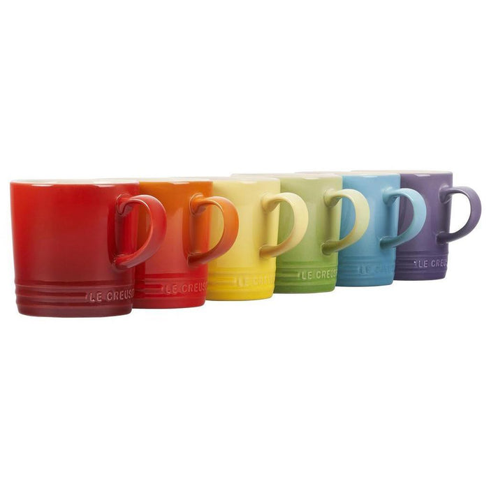 Set of 6 12 oz rainbow Le Creuset stoneware London mugs displayed on a white background
